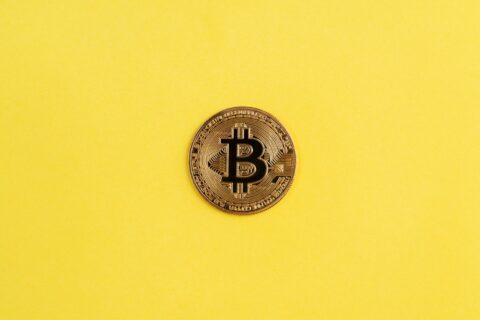 Bitcoin Centered On Yellow Background